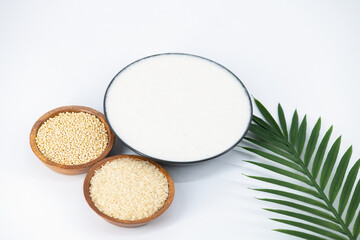 Selective focused image of fermented batter for idli and dosa in an isolated background. Idly and...