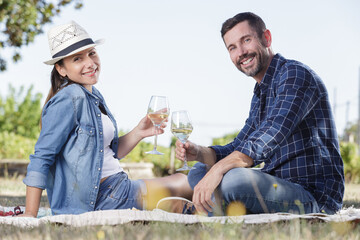 beautiful smiling couple enjoying a picnic day in the park