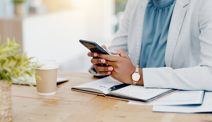 Fototapeta premium Black woman, hands and phone chatting in business for communication, social media or texting on office desk. Hand of African American female typing on smartphone or mobile app for research or chat