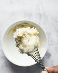 Creaming butter and sugar with a whisk, the process of making a cake, mixing butter and sugar to make a cake