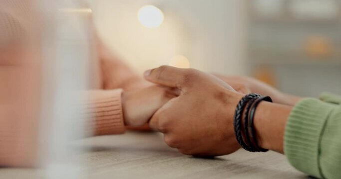 Trust, prayer or couple holding hands together in a Christian home in retirement with hope or faith. Jesus, God or belief with a man or woman in spiritual bond for love, gratitude or care in religion