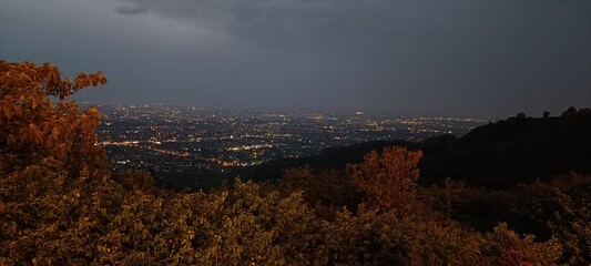 time lapse of clouds over the city at night