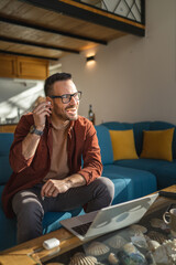 man sit at home use laptop computer to watch movie or have video call