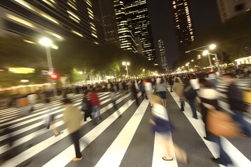Fototapeta na wymiar Time lapse photography of fast moving and busy people in city at night