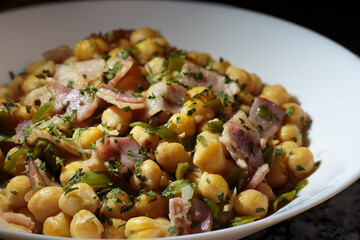 Chickpea dish with bacon, peppers and parsley