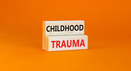Childhood trauma symbol. Concept words Childhood trauma on beautiful wooden blocks. Beautiful...