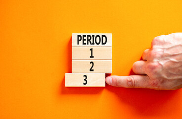 Time to period 3 symbol. Concept word Period 1 2 3 on wooden block. Businessman hand. Beautiful orange table orange background. Business planning and time to period 3 concept. Copy space.