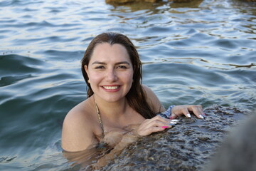 Exotic girl posing in the ocean 