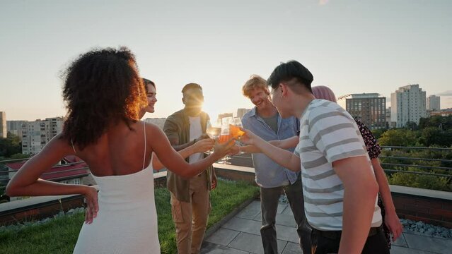 Best friends clinking glasses with alcohol drinks at party