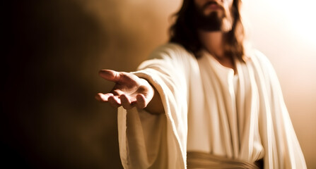 Jesus Christ reaching out his hand against bright background