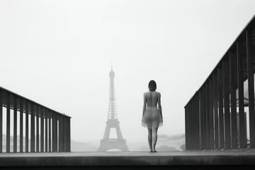 Fotobehang Beauty, fashion and style concept. Minimalist woman model portrait in Paris city landscape background. Foggy city with Eiffel tower in background. Black and white image. Generative AI © Rytis