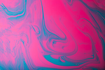 Pink and blue liquid abstract background,made from nail polishes.