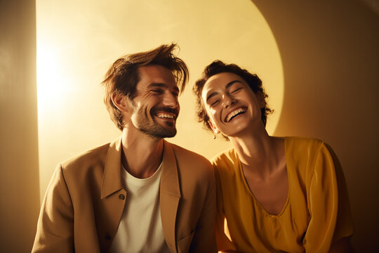 Lifestyles, Fashion And Relationship Concept. Studio Portrait Of Two Young And Beautiful Laughing Couple. Muted Soft Colors. Plain Color Background With Copy Space. Generative AI