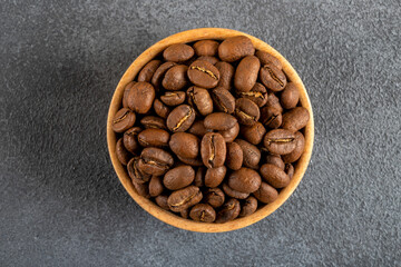 A bowl full of roasted coffee beans,top view