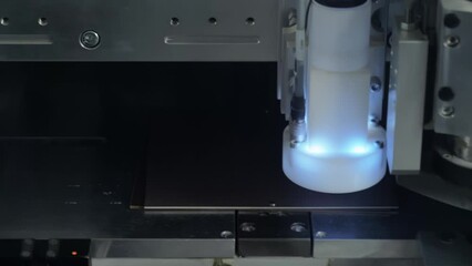 Working Area Of A Modern PCB Milling Machine In Focus. Board Sheet Attached Fixedly To Ensure High Precision Of Holes Drilling. Head Tool Moves On The Left. Electronics Components Manufacturing.