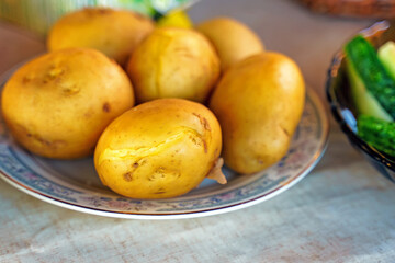 Boiled potatoes with peel on a plate