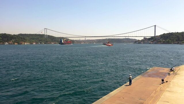 4K panoramic drone footage of Turkish Strait and suspending Bosphorus bridge during daylight. Wide angle shot of European and Asian sides of Istanbul stock video.