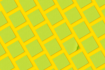 Green sticky notes on yellow background