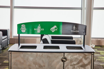 Recycling receptacle with trash section at airport terminal generic