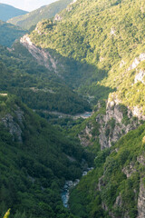 Beautiful view with a river in between two mountains.