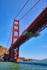 Golden Gate Bridge underside and side from choppy San Francisco Bay waters