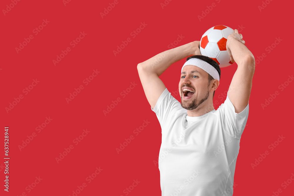 Sticker Happy soccer player with ball on red background