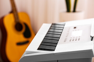 Modern synthesizer in room, closeup