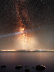 Beautiful night landscape,  bright Milky Way galaxy on the lake.