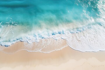 abstract sand beach from above with light blue transparent water
