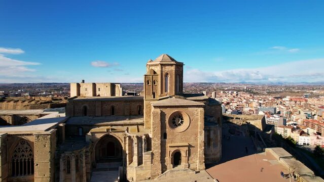 View from drone of Catalan city of Lleida with old medieval 13th century Cathedral of St Mary of La Seu Vella is symbol of reconquista, typical gothic architecture style, iconic monument, Spain. 4K.