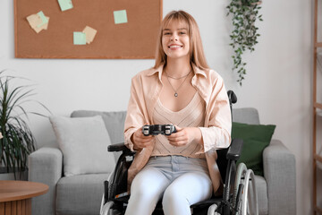 Young woman in wheelchair playing video game at home