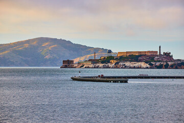 Fototapeta na wymiar Mountain behind Alcatraz Island near sunset with Aquatic Cove