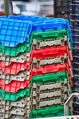 Colorful collection of fruit and vegetable crates