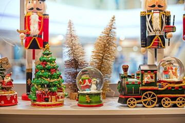 interior deoration with a snowman in a ball with santa claus in a steam locomotive and nutcrackers....