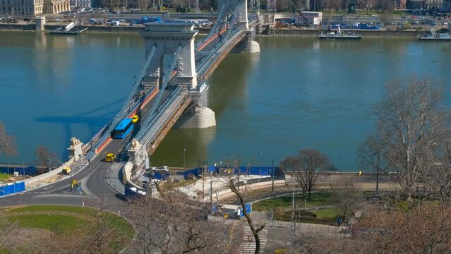 Budapest parliament by secheni bridge. A nice public Secheni bridge over Danube river against famous Budapest places in the day light.