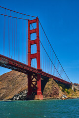 Side view of Golden Gate Bridge with choppy San Francisco Bay waters