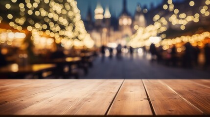 Empty wooden table top with defocused bokeh Christmas Fair lights background. Template for product...
