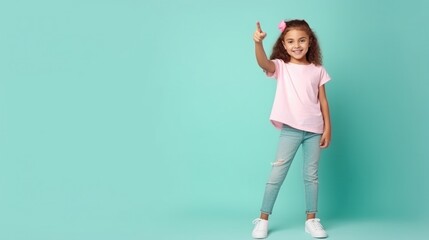 Cute schoolgirl wear pink t-shirt direct fingers empty space