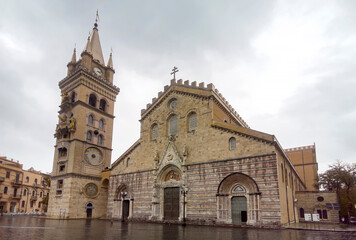 Fototapeta na wymiar Travel in Italy - Messina Cathedral on Piazza Duomo Square in Messina. Bell Tower is famous for biggest and most complex astronomical clock with gilded bronze statues
