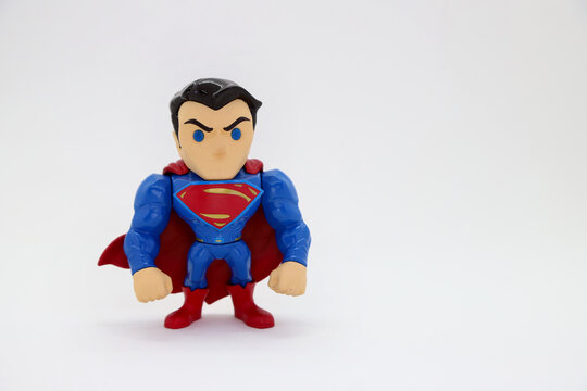 Muscular superhero on white background and with copy space. Superman doll in its Metals Die Cast version. Collectible toy for children made of metal.