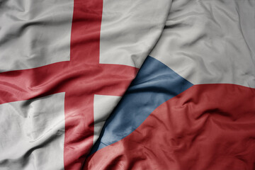 big waving national colorful flag of england and national flag of czech republic .