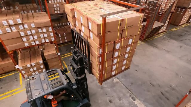 Birdseye View Of Forklift Truck With Boxes In Warehouse