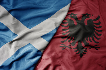 big waving national colorful flag of scotland and national flag of albania . - obrazy, fototapety, plakaty