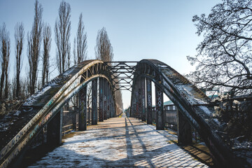 bridge over the river in the forest in winter