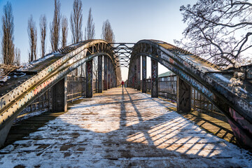 man on the end of steel bridge in winter