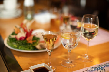 table with glasses and fresh vegetables
