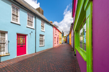 Narrow streets and alleys of brightly colored homes and shops in Kinsale, a historic port and fishing town in County Cork, Ireland.