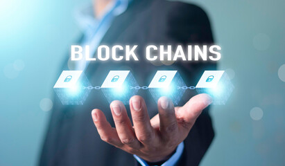 Fototapeta na wymiar Blockchain technology and network concept. Businessman holding text blockchain in hand with icons network connection on blue security and digital connection background