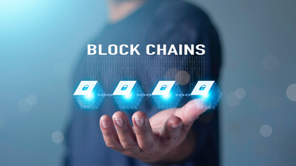 Blockchain technology and network concept. Businessman holding text blockchain in hand with icons network connection on blue security and digital connection background