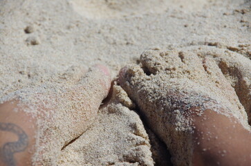 Sandy feet by the beach